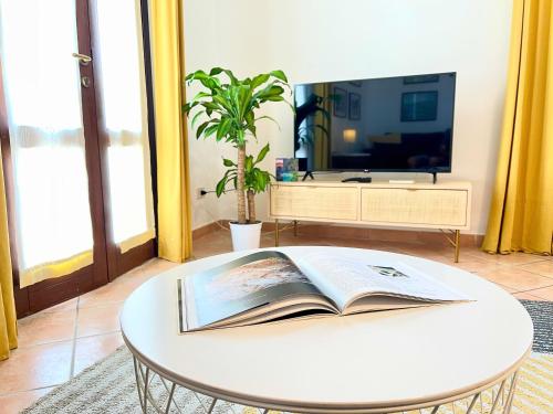 a table with an open book on top of it at La Casetta di Pantelleria in Pantelleria