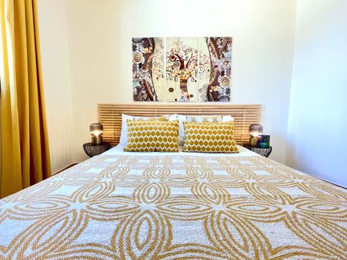 a bedroom with a large bed with yellow curtains at La Casetta di Pantelleria in Pantelleria