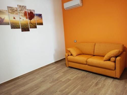 a living room with a couch in a room at A Casitta in Furnari