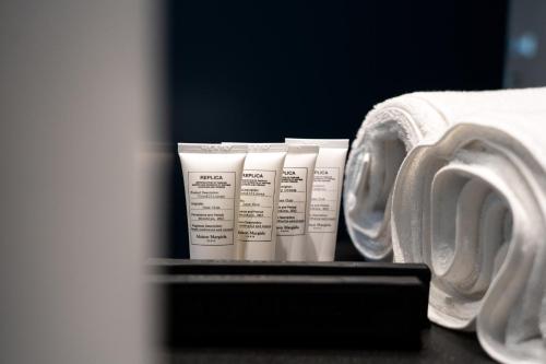 a group of four white rolls of toilet paper at PICCOLA MAESTA' boutique rooms in Civitanova Marche