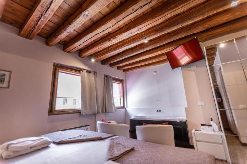 Un ou plusieurs lits dans un hébergement de l'établissement La Bella Verona Wine Suite