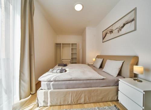 Postel nebo postele na pokoji v ubytování Dolcevita apartments