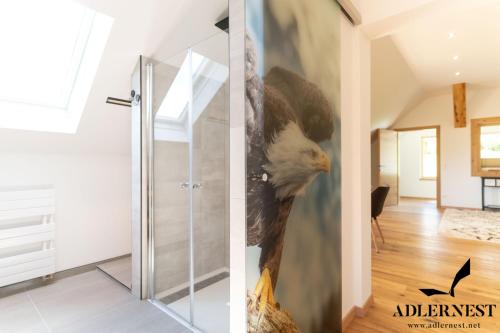 a painting of a bald eagle on the wall of a hallway at Adlernest in Ramsau am Dachstein