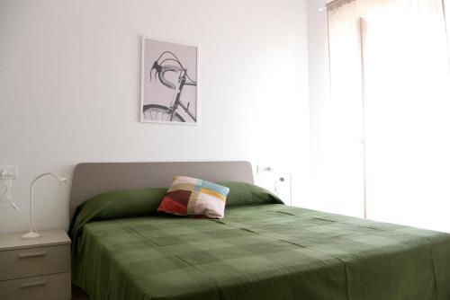 Ένα ή περισσότερα κρεβάτια σε δωμάτιο στο REGI Apartments