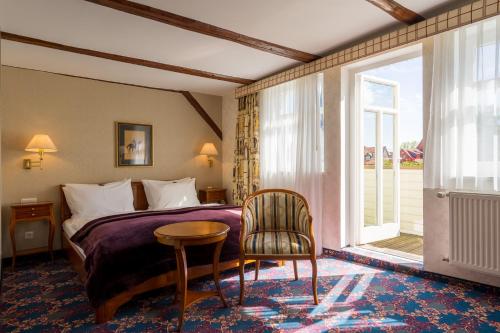 Postel nebo postele na pokoji v ubytování Boutiquehotel Schloßpalais