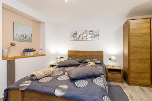 a bedroom with two beds with pillows at Maximilian&Stela in Poreč