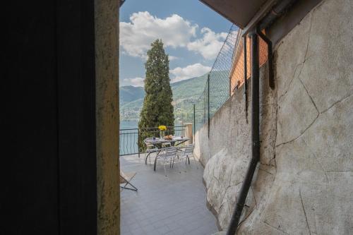 a view of a balcony with a table and chairs at La Casa dell'Architetto by Rent All Como in Blevio