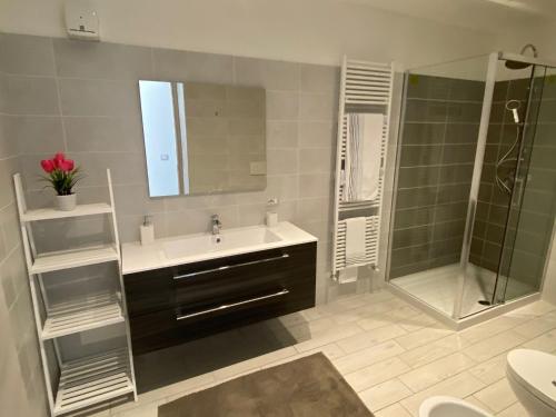 a bathroom with a sink and a shower at Canada in Stresa