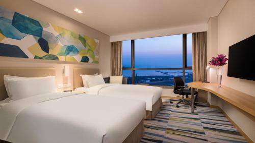 Postel nebo postele na pokoji v ubytování Holiday Inn Express Suzhou Taihu Lake by IHG