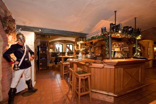 a man standing in front of a bar at Villa Knobelsdorff in Pasewalk