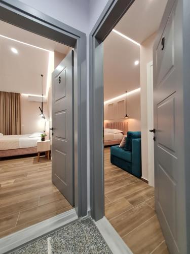 a room with a door leading to a bedroom at Himara 28 Hotel in Himare