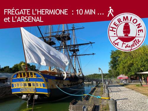 a large boat is docked in the water at Bleu Soleil Rochefort 3 étoiles in Rochefort