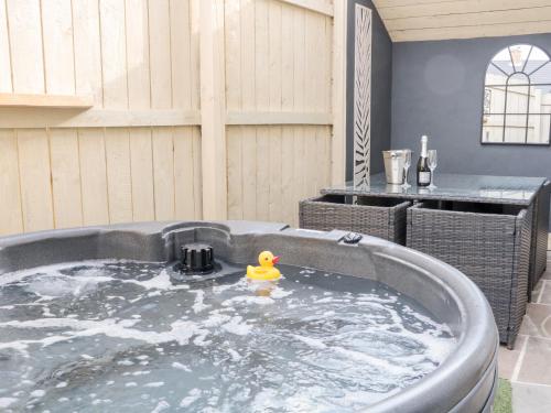 a rubber duck in a hot tub in a backyard at 6 Lock View in Skipton