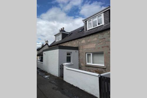 a view of a house from the street at Shadow's Cottage situated in Fishertown, Nairn. in Nairn