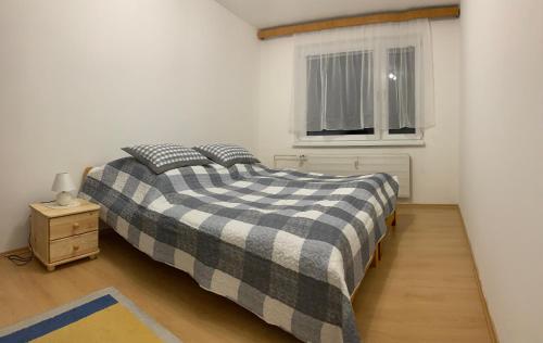 Ένα ή περισσότερα κρεβάτια σε δωμάτιο στο Apartmán v centre