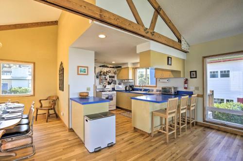 a large kitchen with blue counter tops and chairs at Walk to Beach Oregon Coast Escape with Hot Tub! in Lincoln City