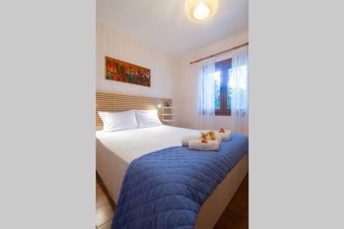 Postel nebo postele na pokoji v ubytování Natsios Thanasakis Apartment