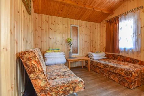 Postel nebo postele na pokoji v ubytování Sodyba Džiugutis