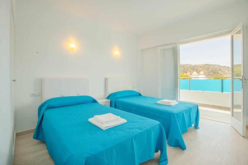 Ένα ή περισσότερα κρεβάτια σε δωμάτιο στο Dols mar apartments