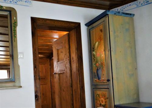 a door in a room with a painting on the wall at Стаи за гости The Old House in Velingrad