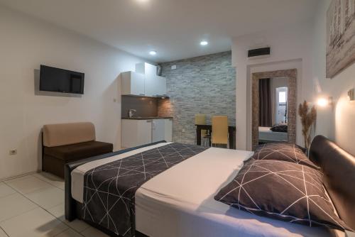 Кровать или кровати в номере Apartments Orlic