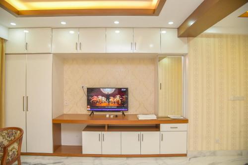 a room with a desk with a computer on it at The Castle Inn in Dhaka