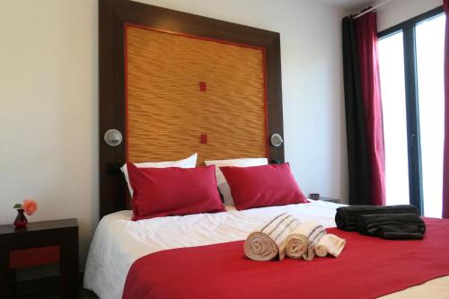 a hotel room with a bed with towels on it at Villa Carémeau 1 in Nîmes