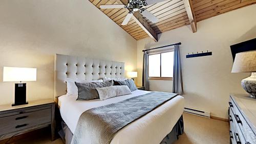 a bedroom with a large bed and a ceiling fan at Timberline Condominiums 1 Bedroom plus Loft Deluxe Unit A3C in Snowmass Village