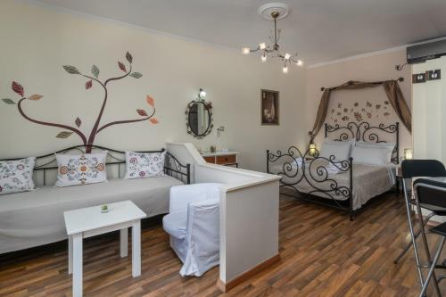 a living room with a bed and a table at Orama Milos in Adamas
