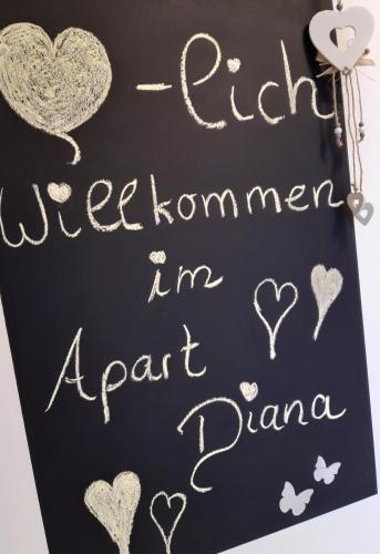 a handwritten sign with hearts on a blackboard at Ferienwohnungen Apart Diana in Vils