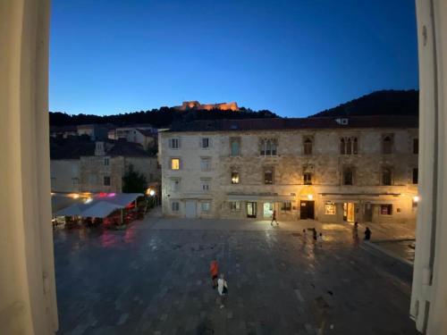 a view from a window of a building at night at Apartman Torre in Hvar