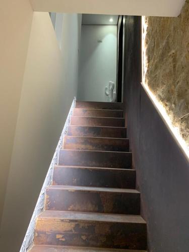 a staircase leading up to a hallway with a door at Duomo House in Caltanissetta