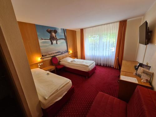 Postel nebo postele na pokoji v ubytování Hotel & Restaurant Wilhelm von Nassau