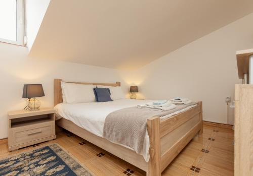 מיטה או מיטות בחדר ב-Apartment Sea Breeze