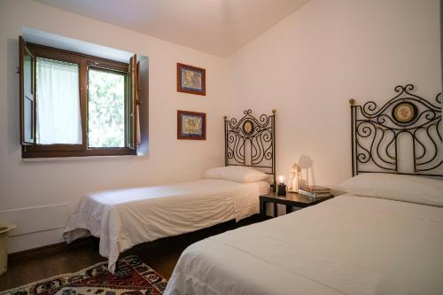 Ένα ή περισσότερα κρεβάτια σε δωμάτιο στο Casale Lillina