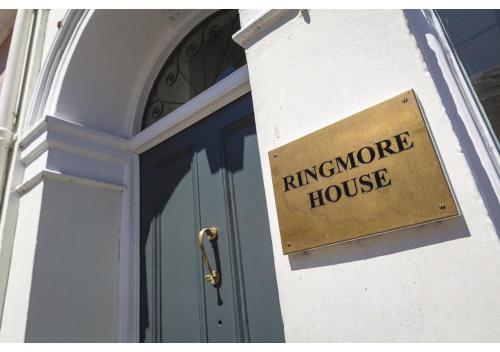 a sign on the side of a building that reads hurricane house at The Old Post Office - Parking Available - 75 meters Estuary in Salcombe