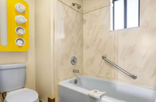 a bathroom with a white tub and a toilet at Motel 6-Payson, AZ in Payson