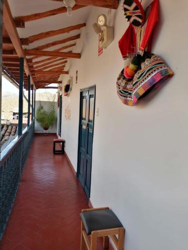 a hallway of a house with a door at La Estación San Pedro in Cusco