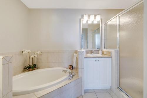 a bathroom with a tub and a sink and a shower at Lely-Best of Beautiful Naples Free golf from May 15-October 15 in Naples