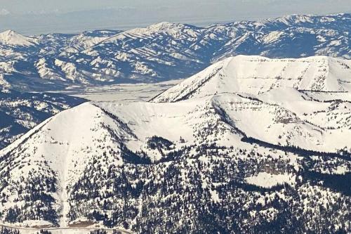 an aerial view of mountains covered in snow at Bear Lair at Teton Valley Idaho in Victor