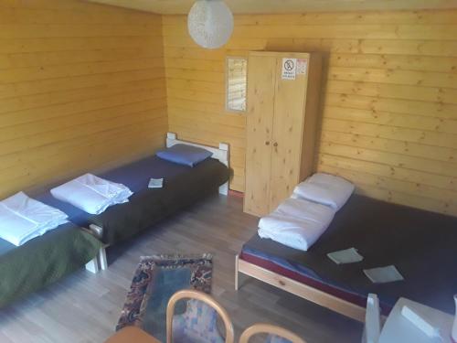 Katil atau katil-katil dalam bilik di Kempings Jūrmalnieki