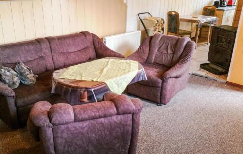 a living room with a couch and two chairs and a table at Lovely Home In Schorfheide With Wifi in Schorfheide