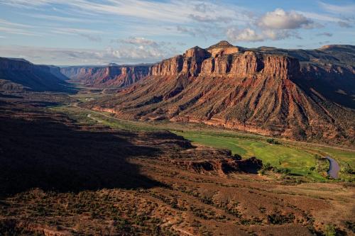 an aerial view of a canyon with a mountain at Gateway Canyons Resort, a Noble House Resort in Gateway