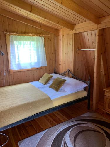 Cama ou camas em um quarto em Domki Florentyna