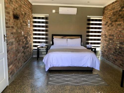 Ένα ή περισσότερα κρεβάτια σε δωμάτιο στο Fairview Guest House Hartswater