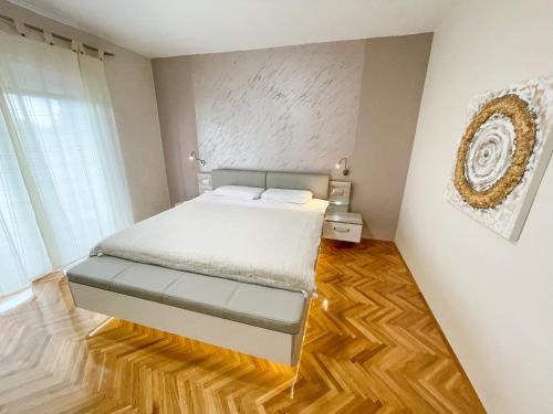 Posteľ alebo postele v izbe v ubytovaní Apartmani Oaza