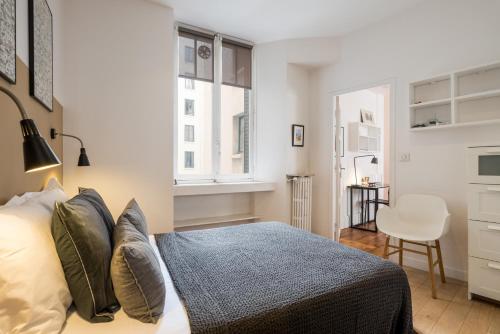 Ένα ή περισσότερα κρεβάτια σε δωμάτιο στο HONORÊ SUITE BOISSAC