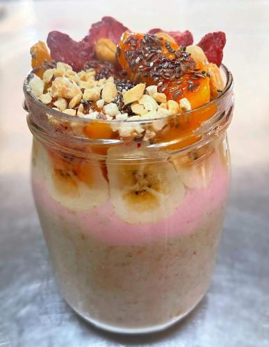 a jar filled with a dessert with fruit and nuts at Jony's Beach Resort in Boracay