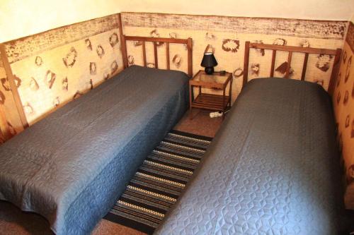 two twin beds in a room with at Villa Sunshine / Slunečna Vila in Krásná Lípa