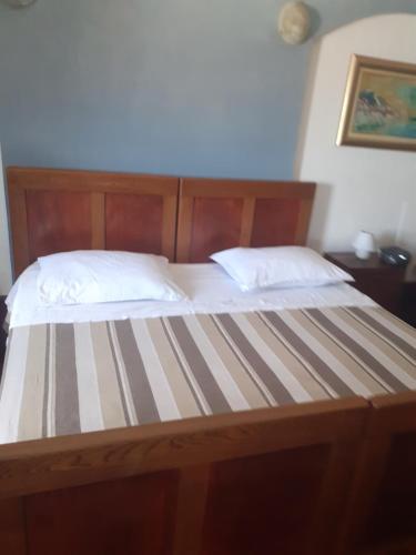 Postel nebo postele na pokoji v ubytování Apartments Sekoko